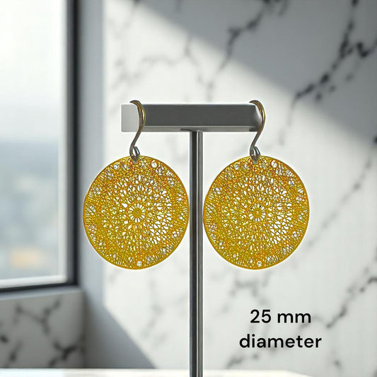 Gold Geometric disc titanium earrings 25mm diameter on a marble background