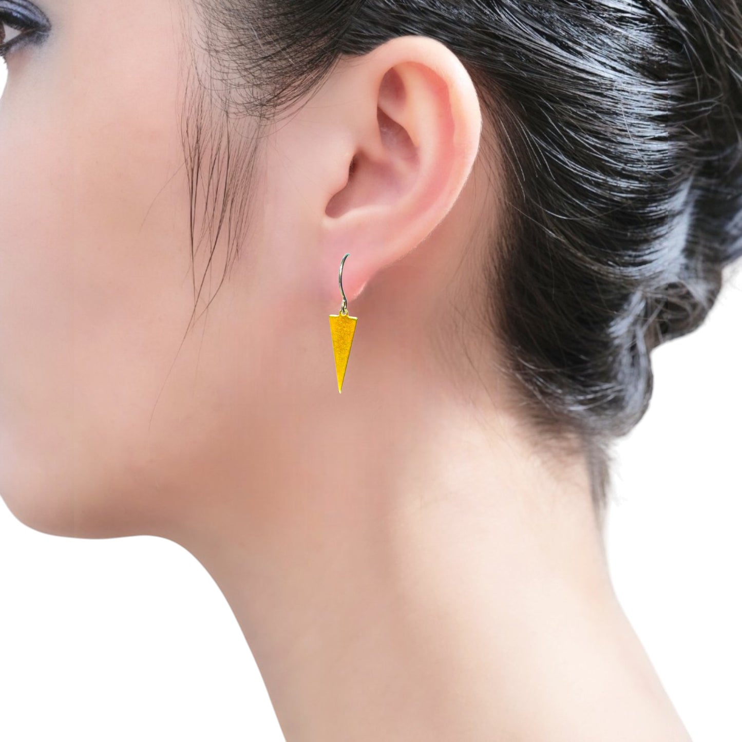 Minimal Narrow Triangle Earrings with a titanium hook on a white young woman