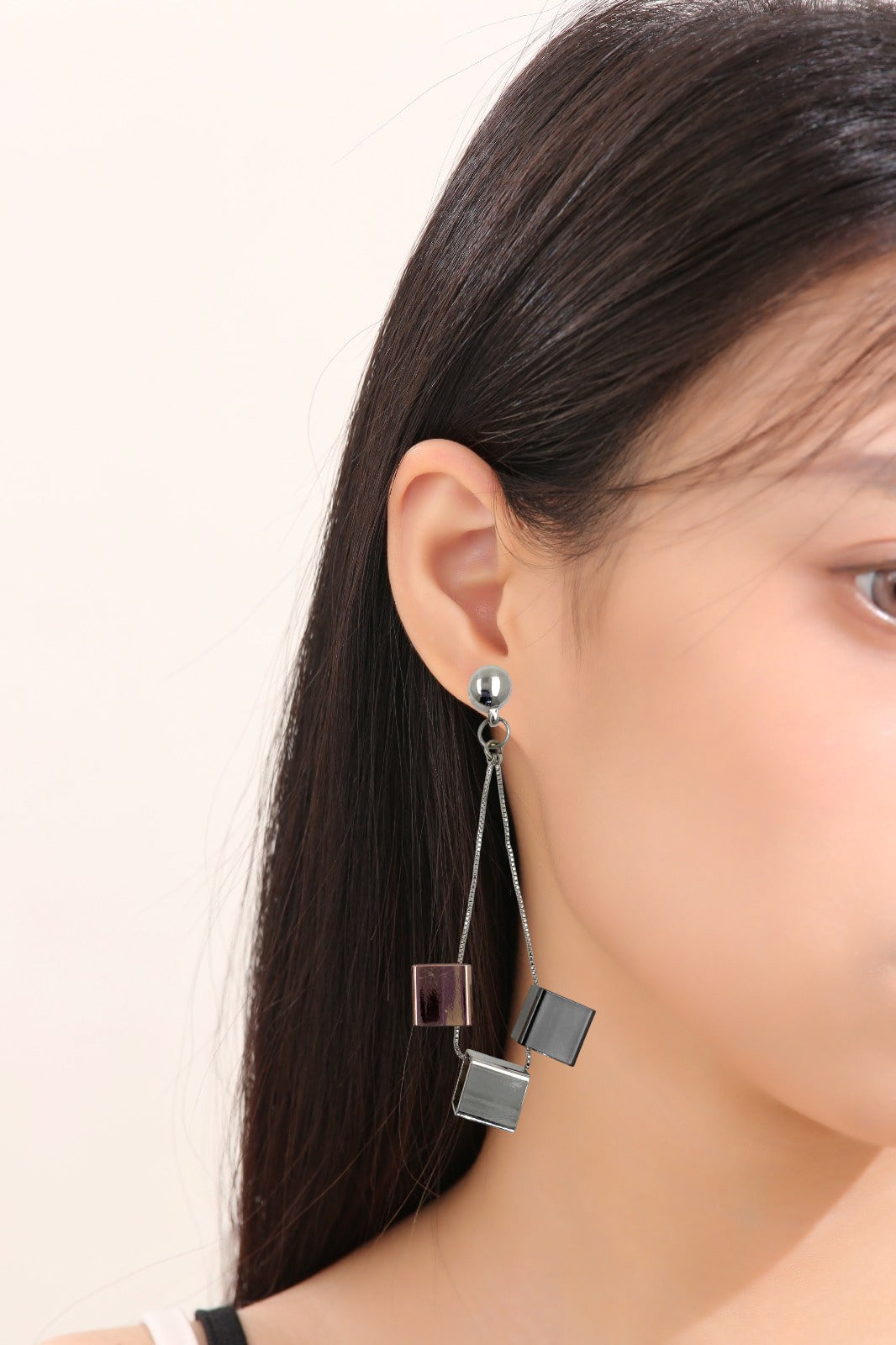 Cubed earrings. Magnetic titanium interchangeable earring system. Detachable earrings for a truly hypoallergenic jewellery on a white young woman