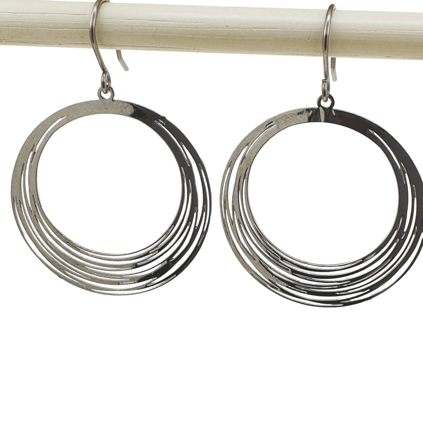 Silver String Ring earrings that are round and a titanium hook on a white background