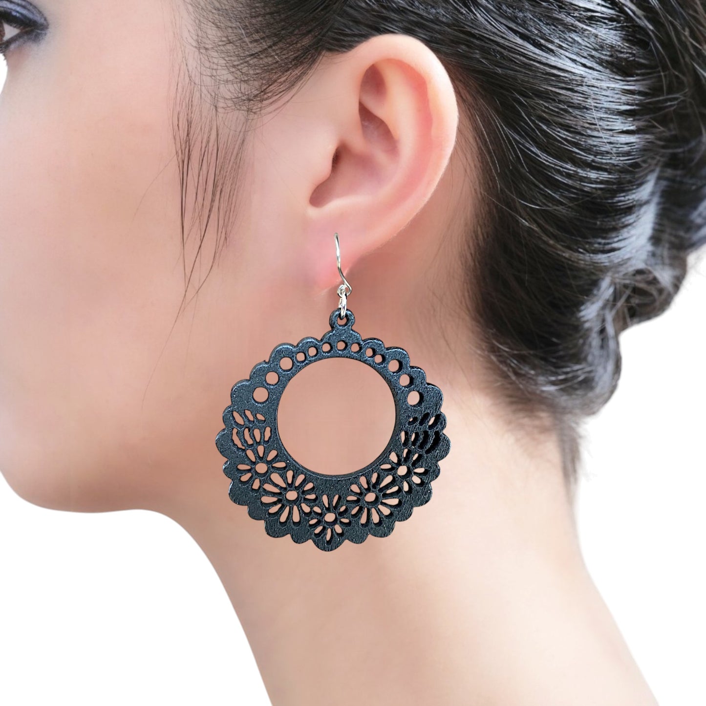 Wooden black Floral titanium earrings on a white woman