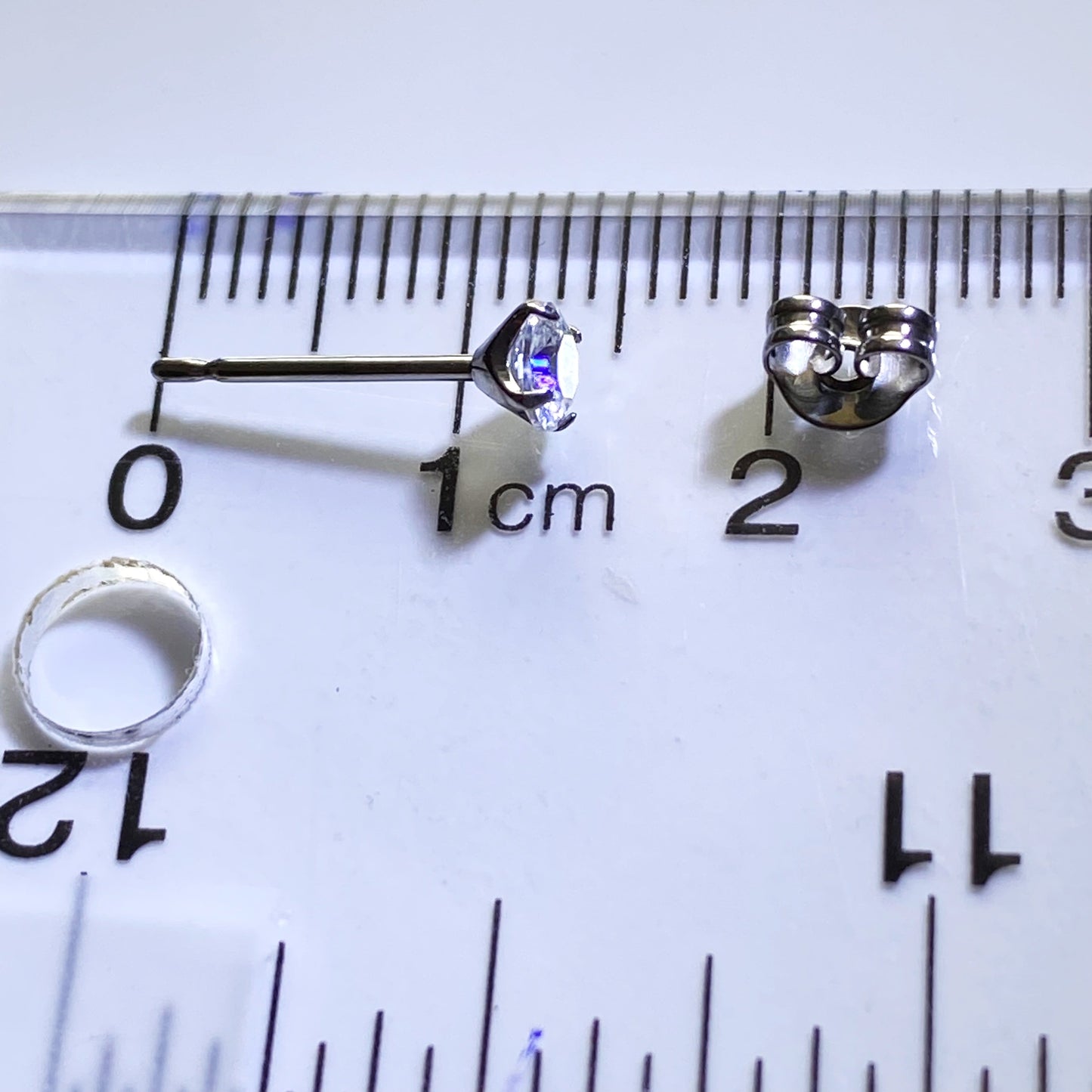 Diamond Gem Titanium Studs 4mm standard fit. Dimensions on a ruler