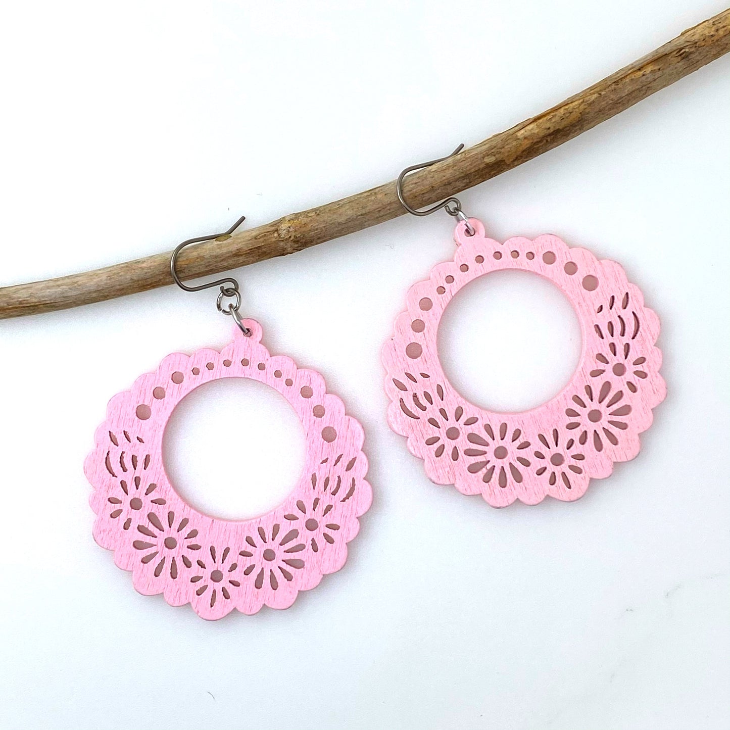 Wooden Floral earrings on a white background. pink