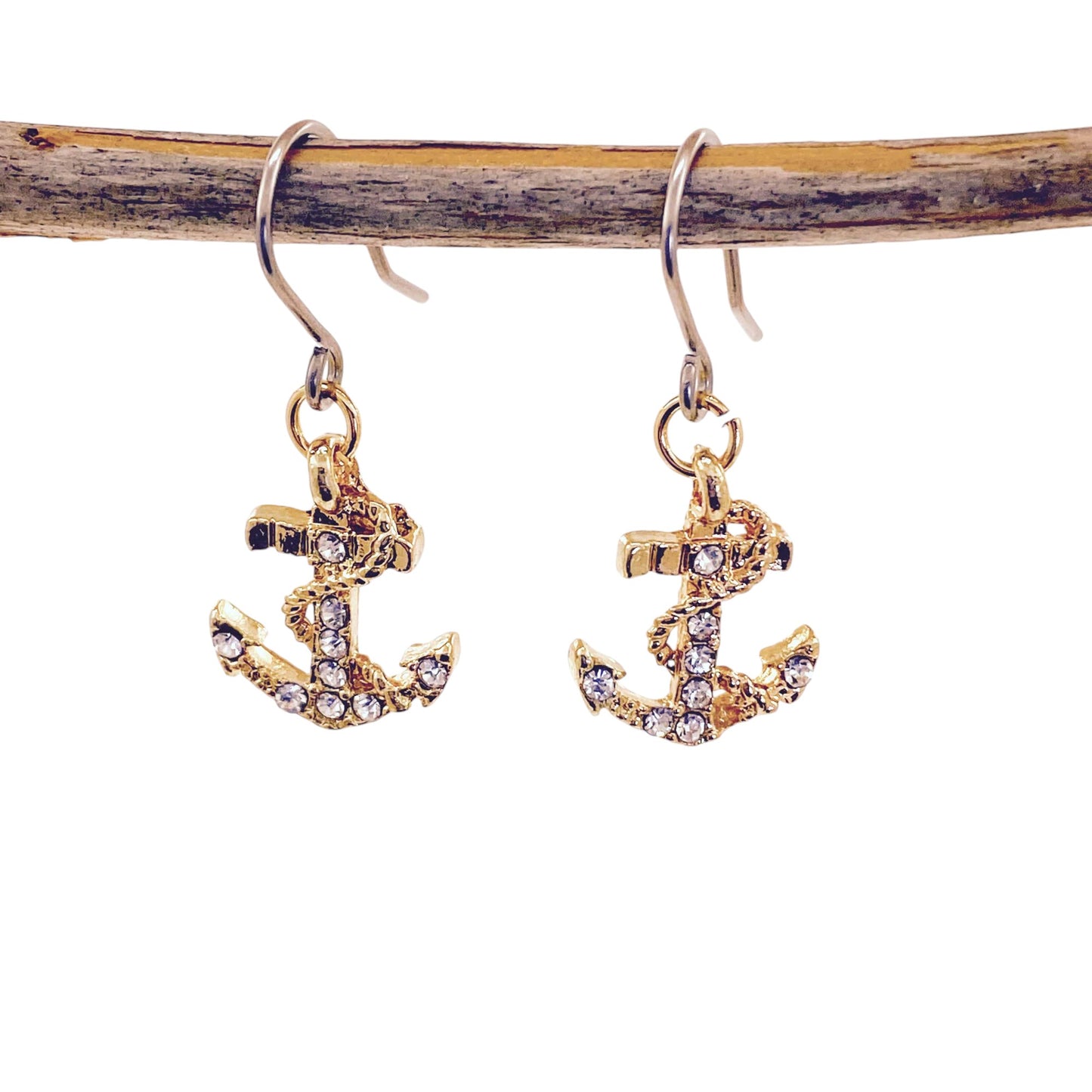 Anchor drop earrings with titanium hook. Gold with 9 gleaming gem stones.