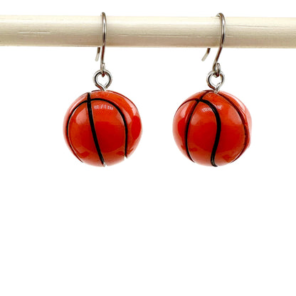 Basketball drop earrings with titanium hook on a white background