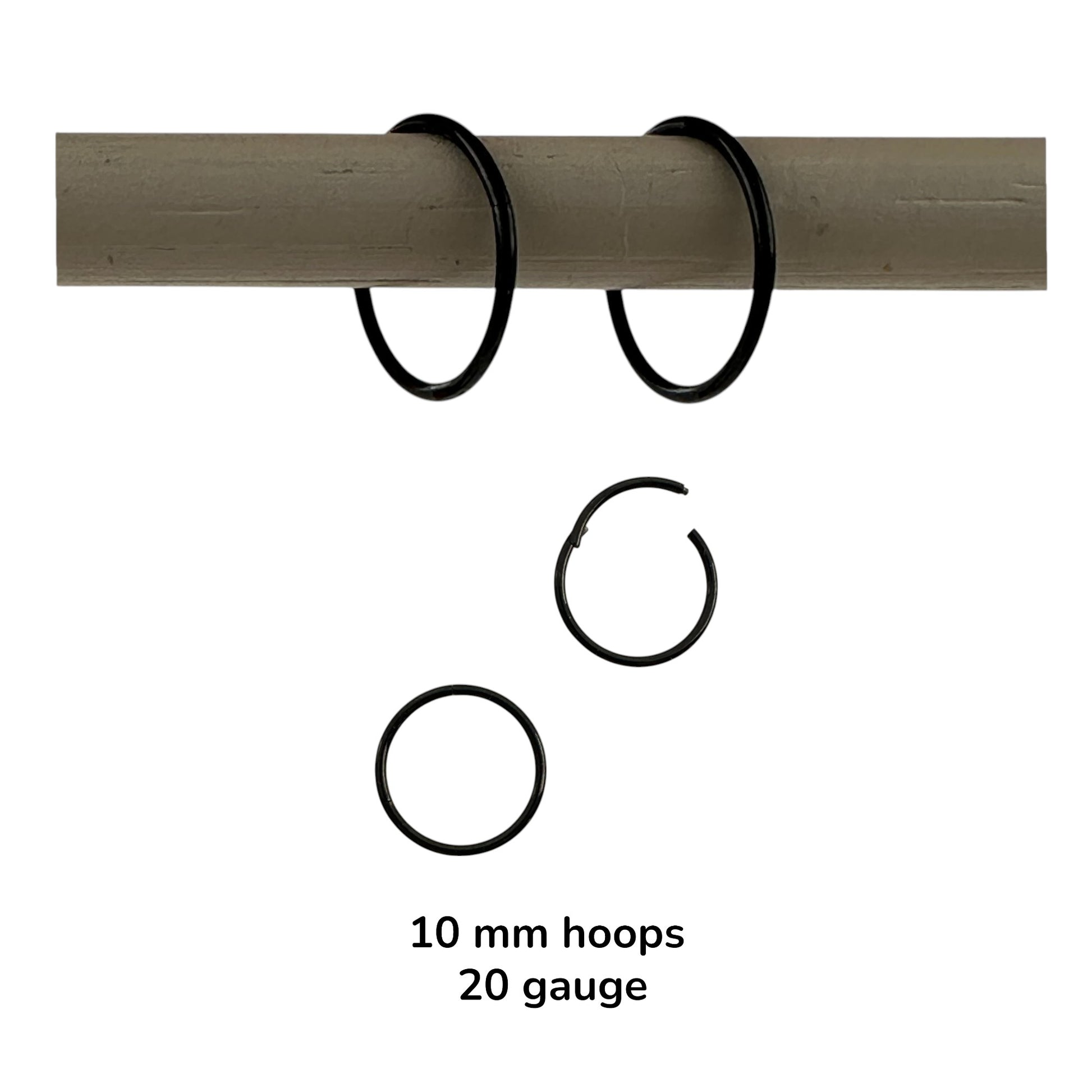 Black anodzed titanium hoop earrings sized on a white background