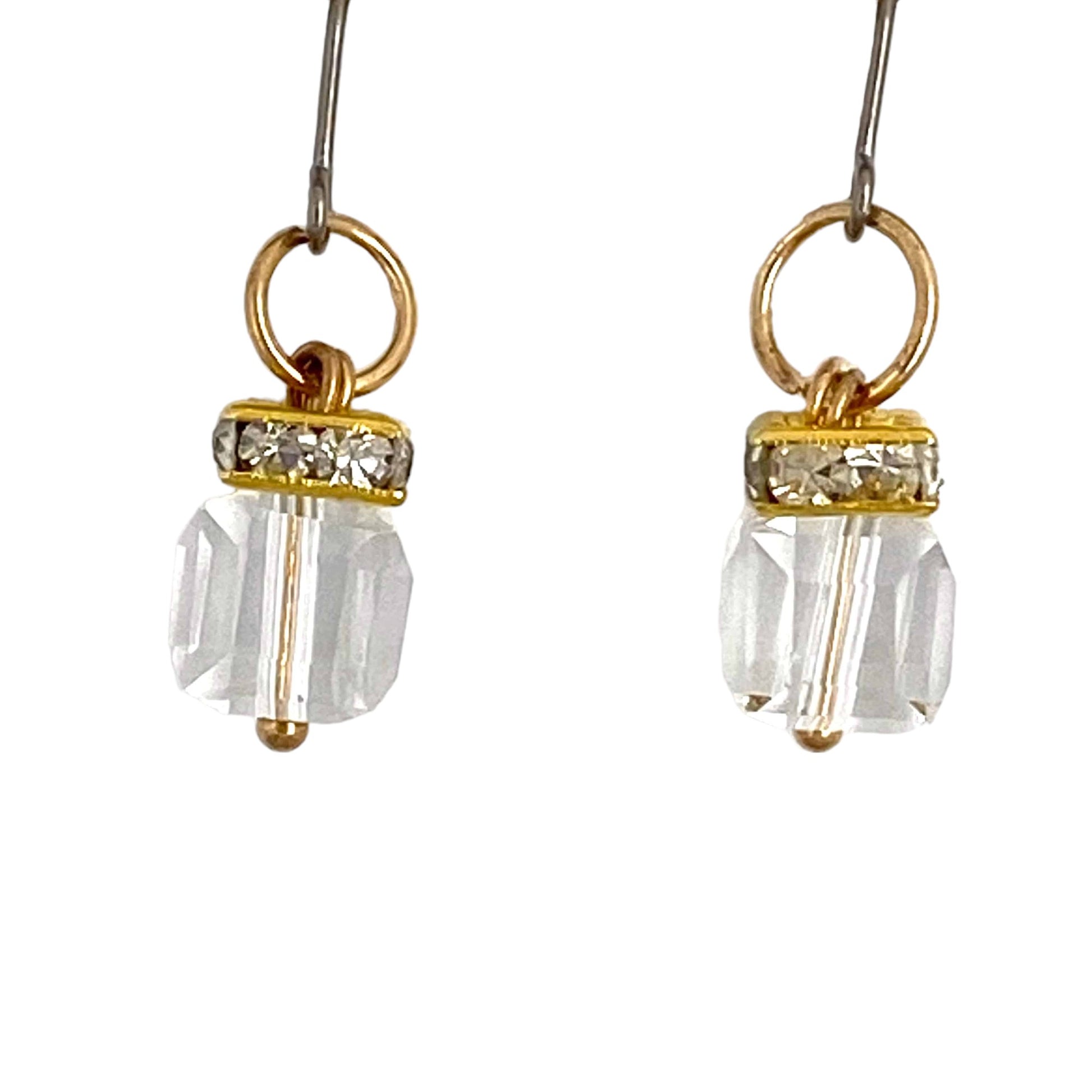 Crystal Clutch earrings with titanium hooks. A flashing crystal with a gold