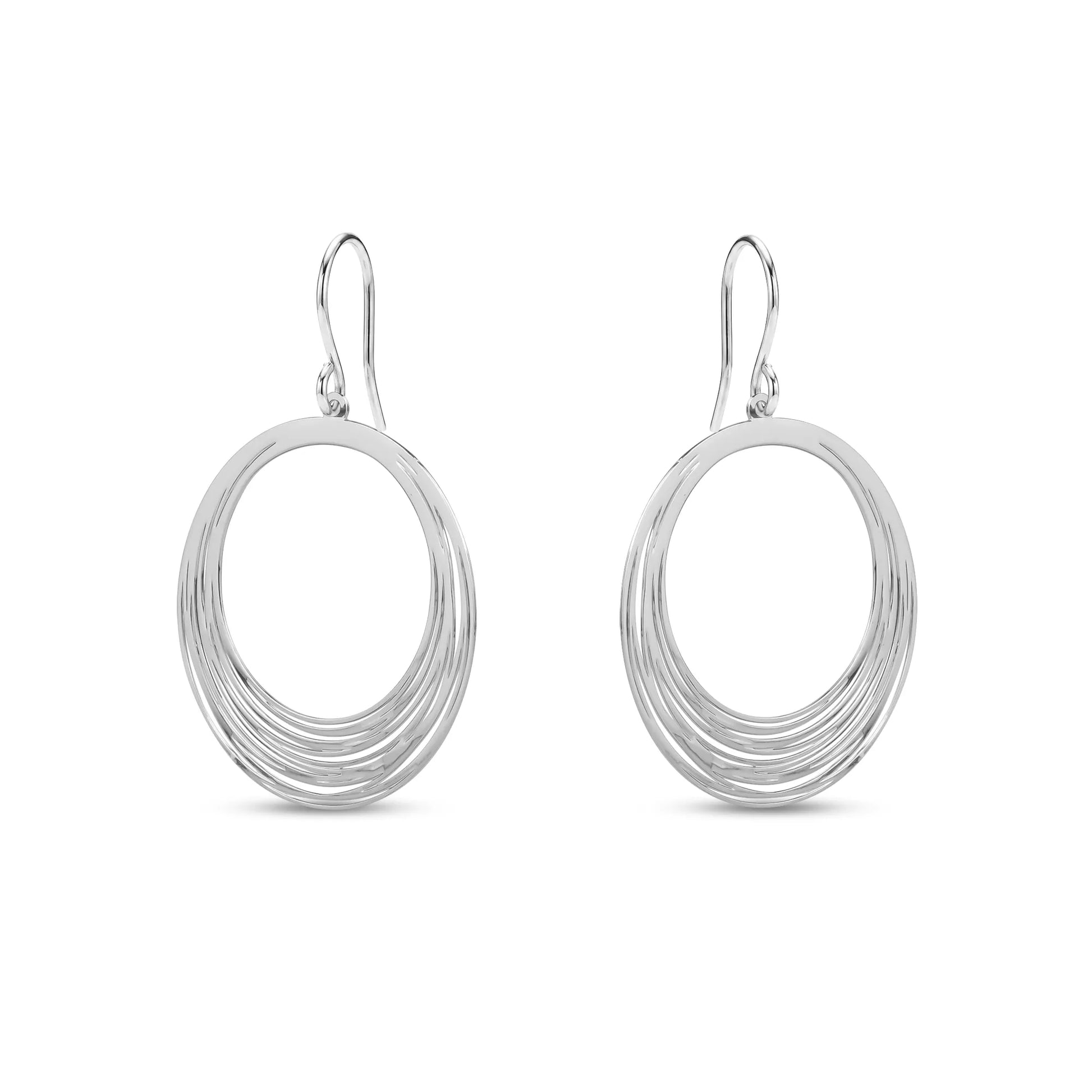Pair of silver titanium hoop earrings on a white background