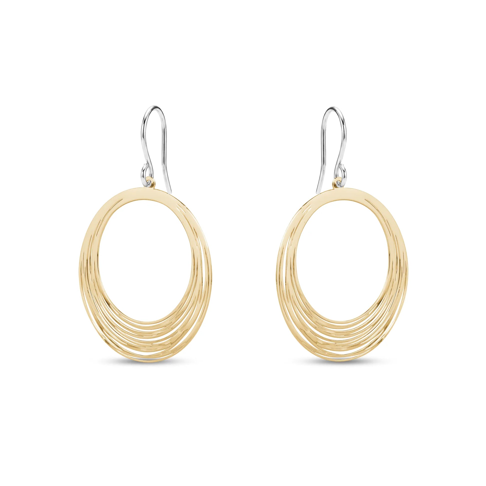 Gold titanium hoop earrings on a white background