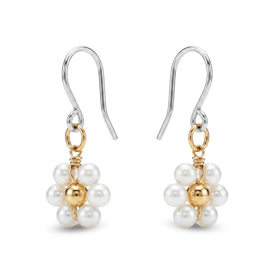 Pair of titanium earrings with pearls and gold accents on a white background