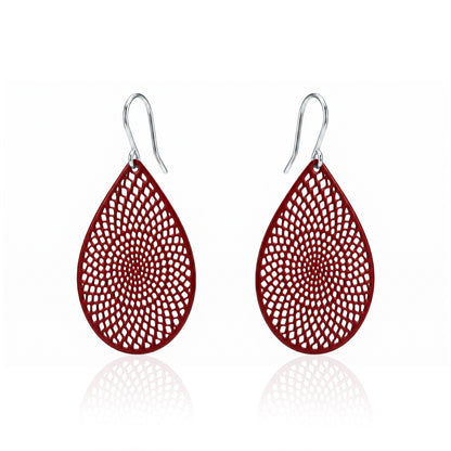 Red teardrop earrings with titanium hook. on a white background