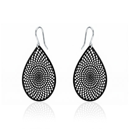 Black teardrop earrings with titanium hook. on a white background