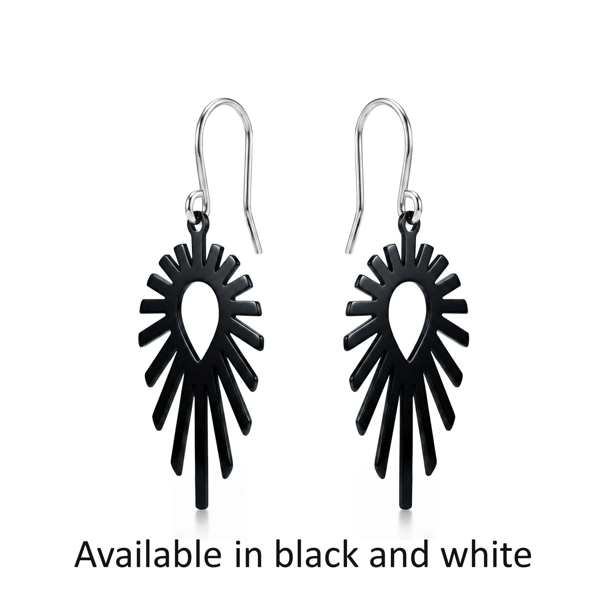 Black titanium shine earrings on a white background with text 'Available in black and white'.