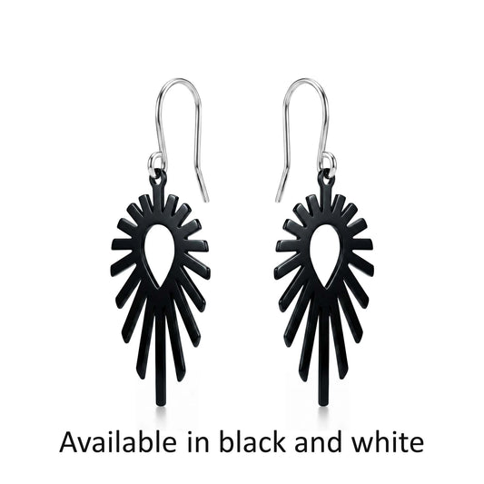 Black titanium shine earrings on a white background with text 'Available in black and white'.