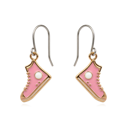 A pair of dangling earrings shaped like pink high-top sneakers with gold-tone outlines, titanium hooks, and small white circular details, shown on a plain white background.