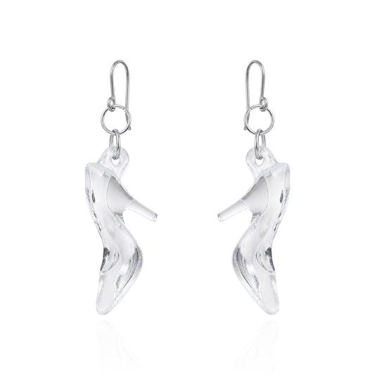 A pair of titanium silver dangle earrings shaped like high-heeled shoes, shown on a clean white background with a subtle reflection below.