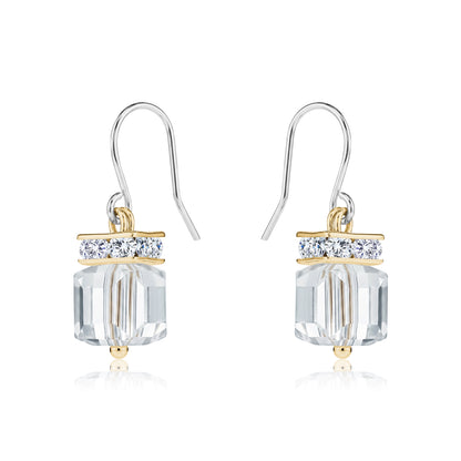 Crystal Clutch earrings with titanium hooks. A flashing crystal with a gold on a white background