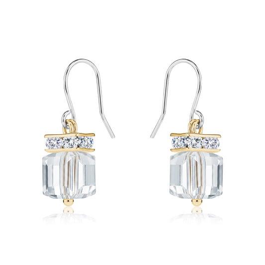 Crystal Clutch earrings with titanium hooks. A flashing crystal with a gold on a white background