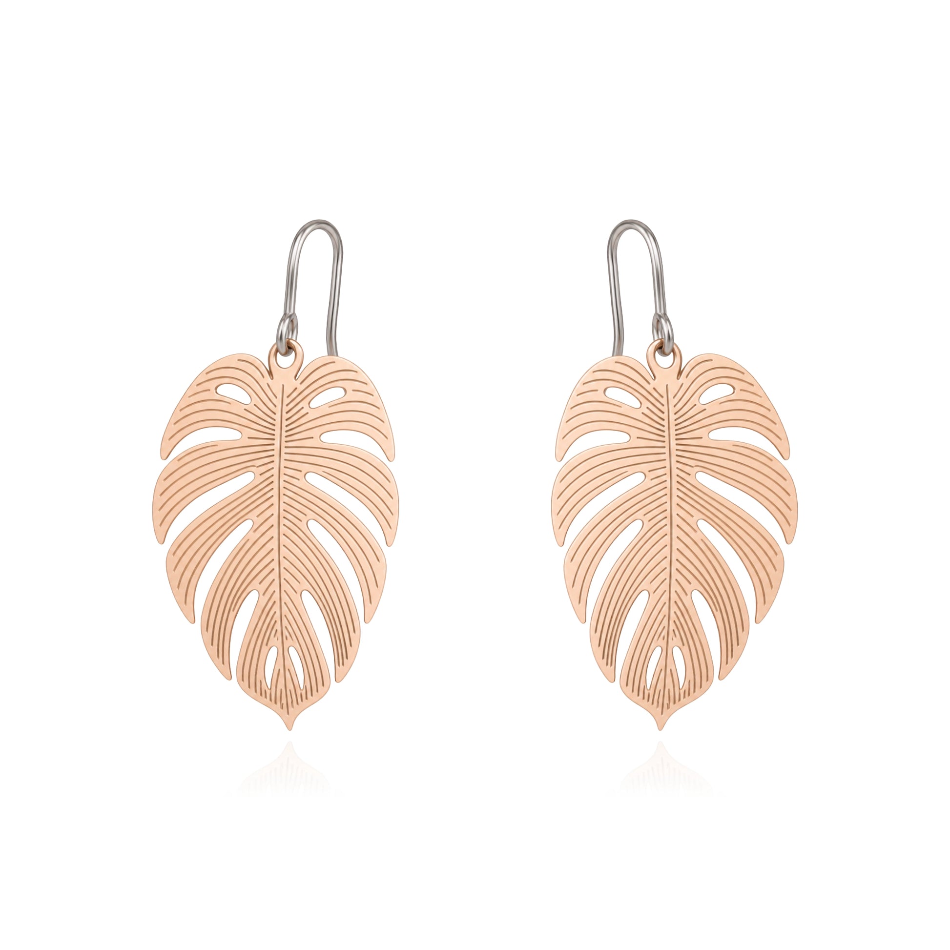 A pair of leaf-shaped drop earrings with a gold finish and titanium hooks, displayed on a clean white background.