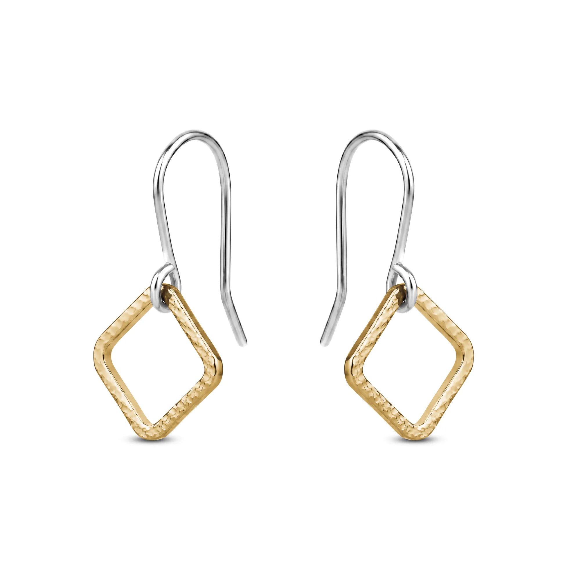 Pair of gold titaniumr earrings on a white background