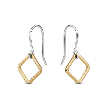 Pair of gold titaniumr earrings on a white background
