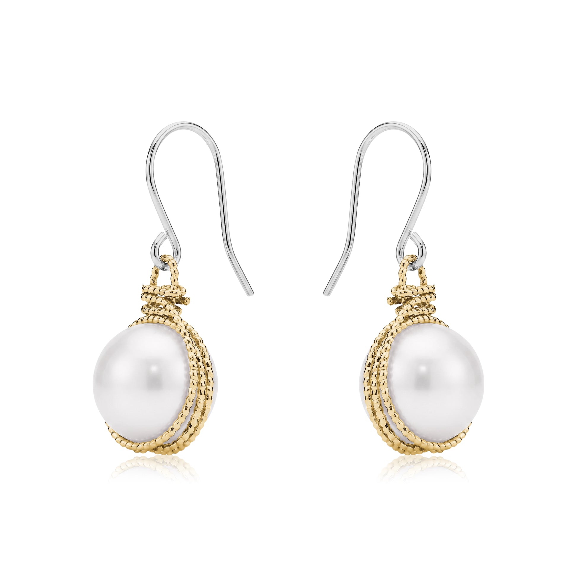 Gold caged pearl earring a titanium hook on a white backgroundearrings on a white background 