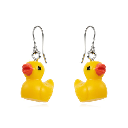A pair of yellow rubber duck charm earrings with titanium fishhook wires and small red beaks, shown on a plain white background.