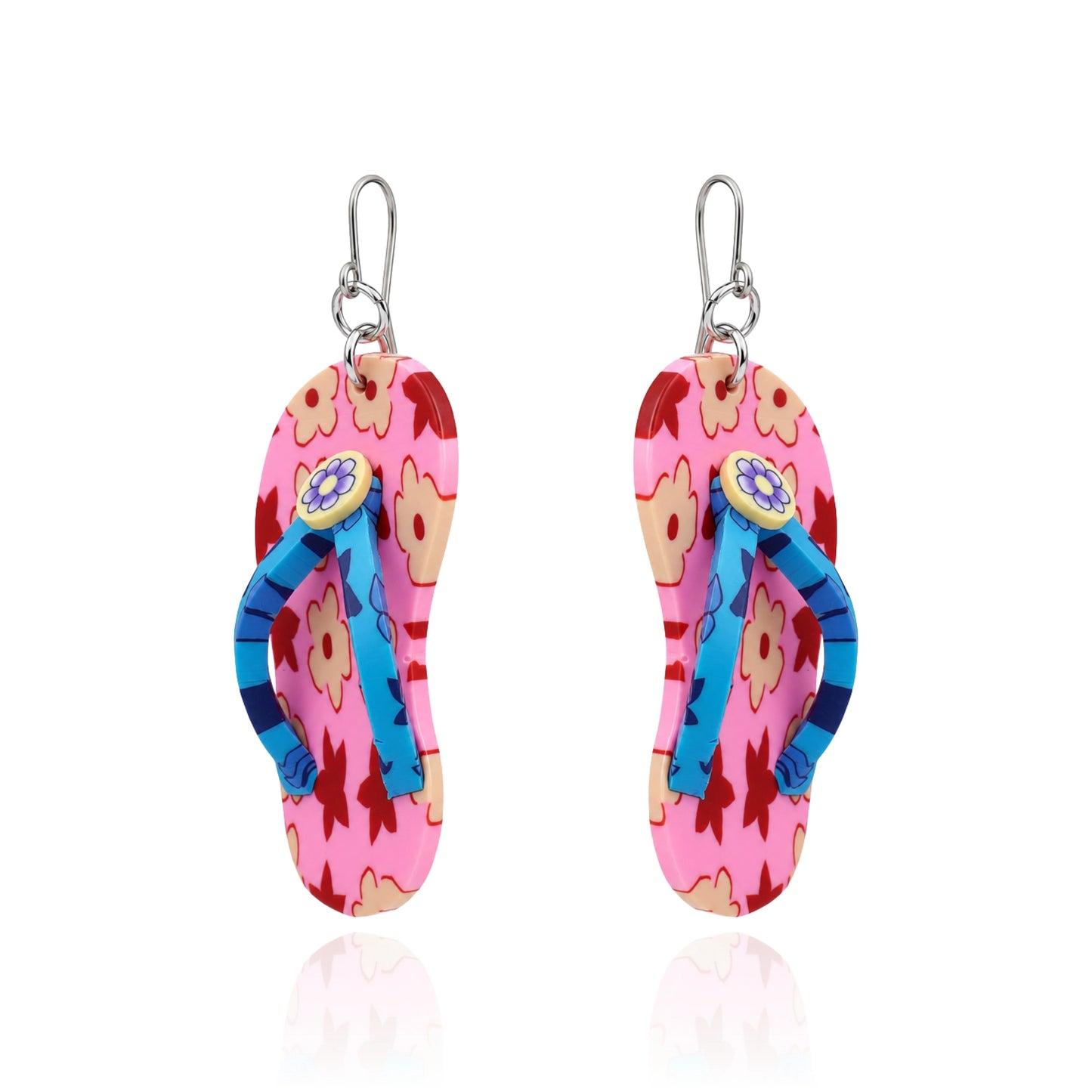 A pair of titanium dangling flip-flop-shaped earring. The earring has a pink and orange floral upper with blue straps