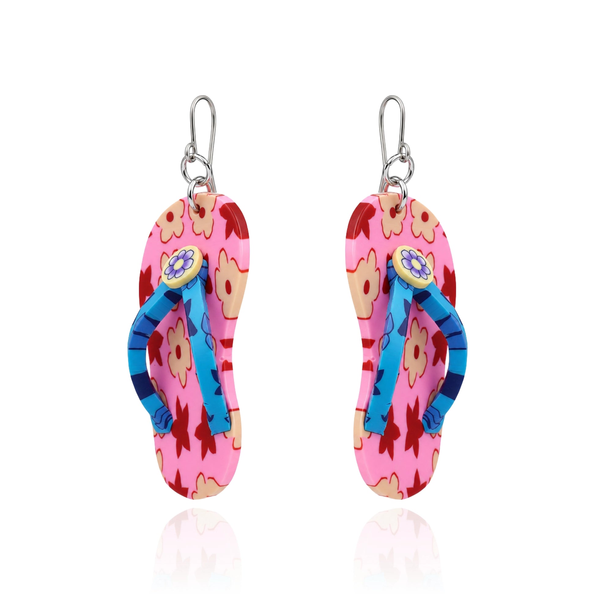 A pair of titanium dangling flip-flop-shaped earring. The earring has a pink and orange floral upper with blue straps