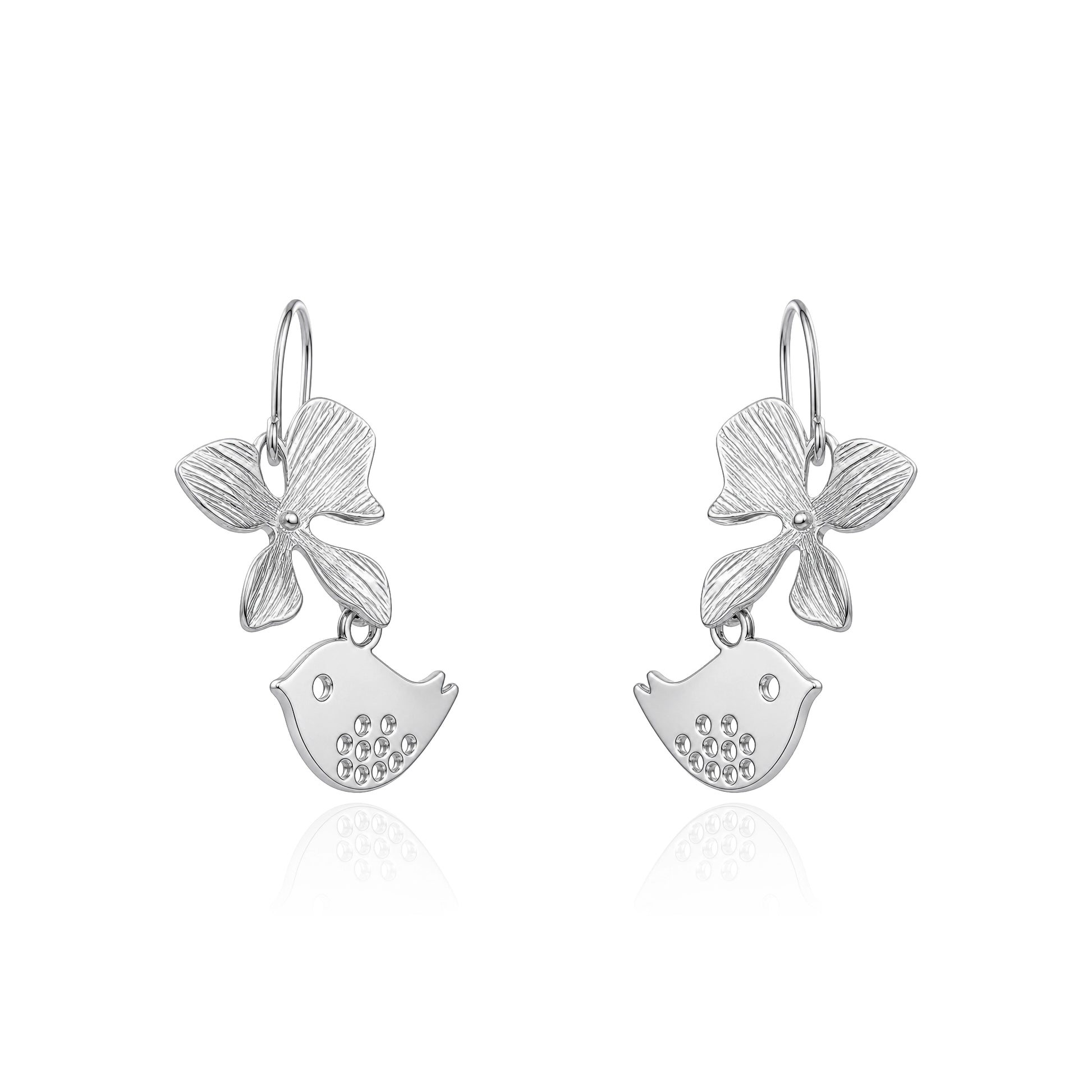 A pair of titanium dangle earrings featuring a textured flower and a small bird charm shown on a white background 