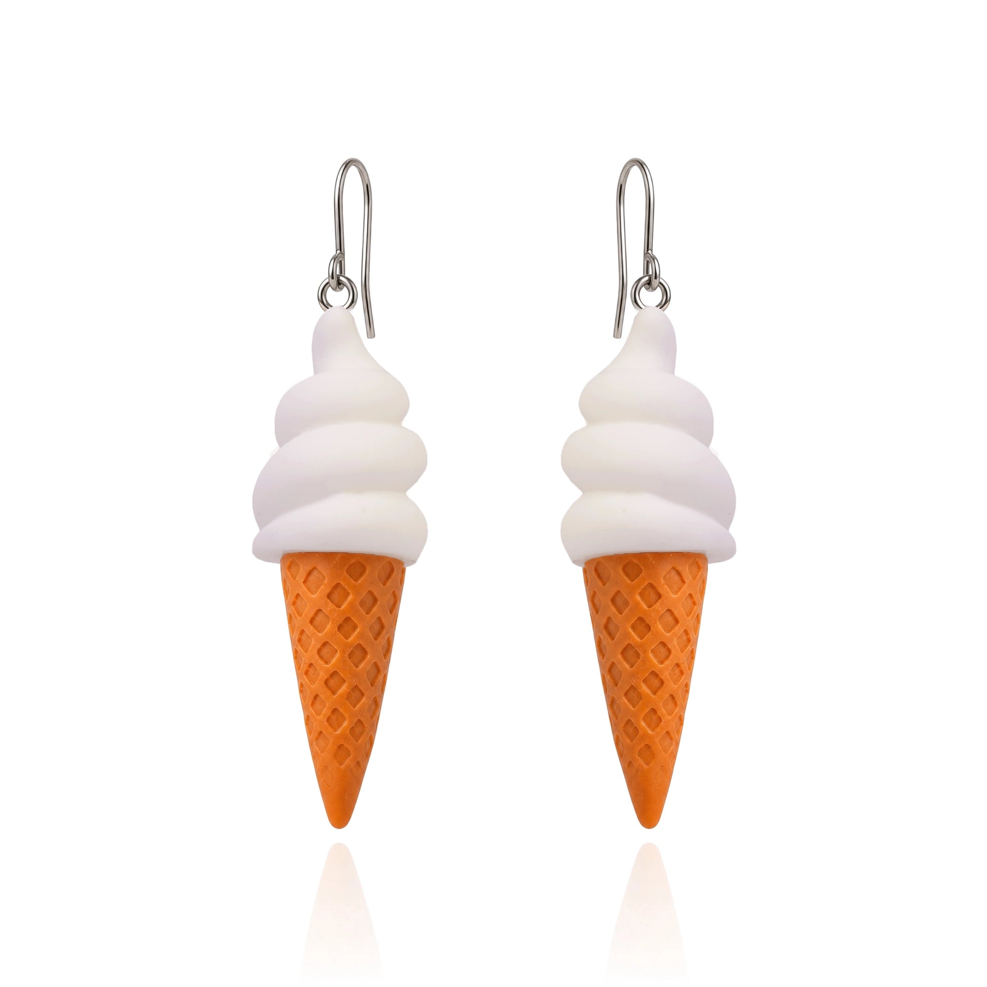 A pair of dangling earrings shaped like ice cream cones, with white swirls representing soft serve and an orange waffle-cone base, hanging from titanium fishhook ear wires on a white background.