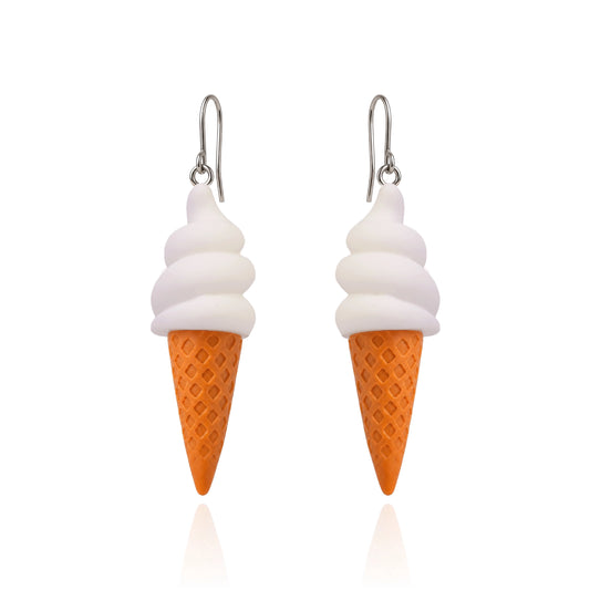 A pair of dangling earrings shaped like ice cream cones, with white swirls representing soft serve and an orange waffle-cone base, hanging from titanium fishhook ear wires on a white background.