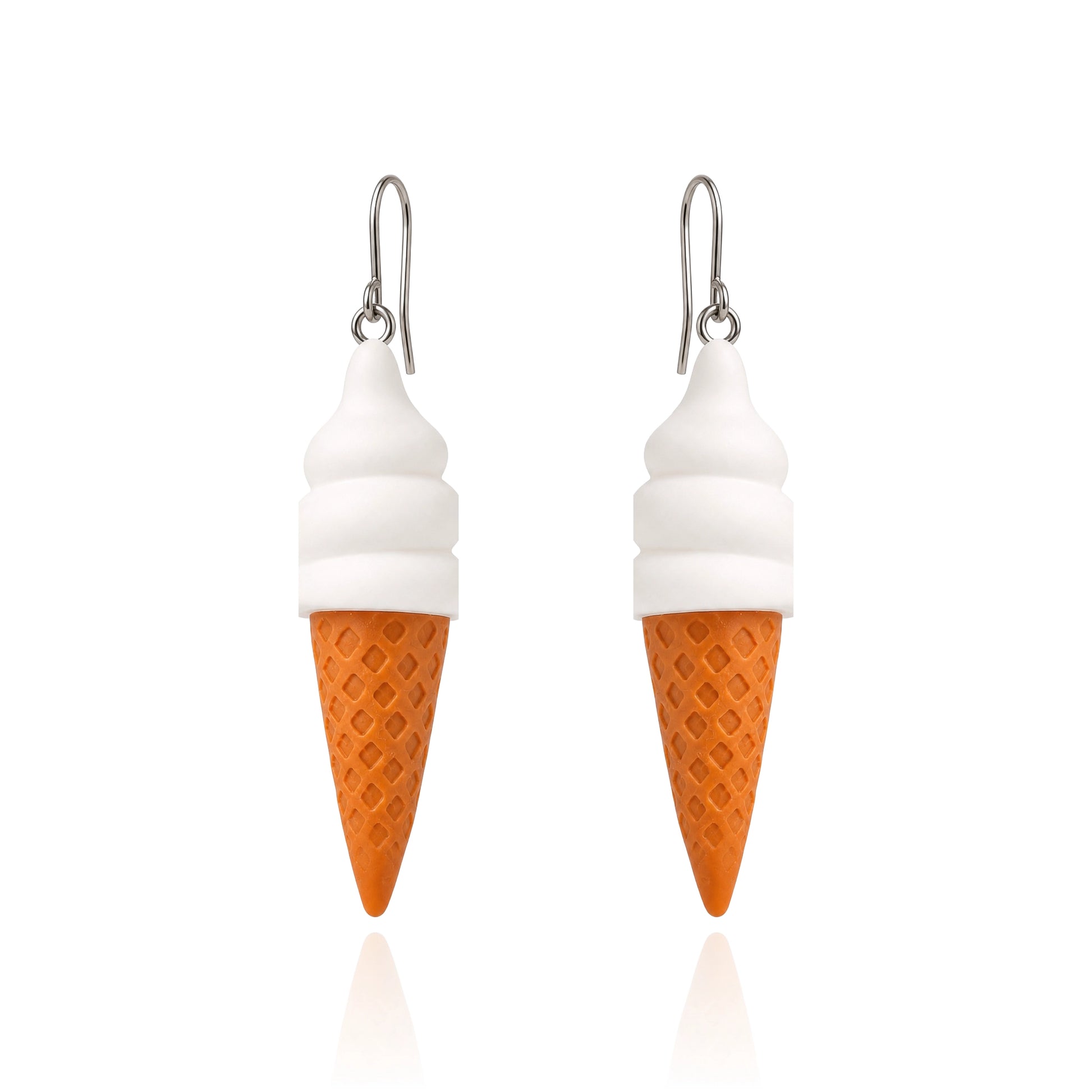 A pair of dangling earrings shaped like ice cream cones, with white swirls representing soft serve and an orange waffle-cone base, hanging from titanium fishhook ear wires on a white background.