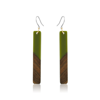 Translucent wood green earrings with titanium hook. on a white background 