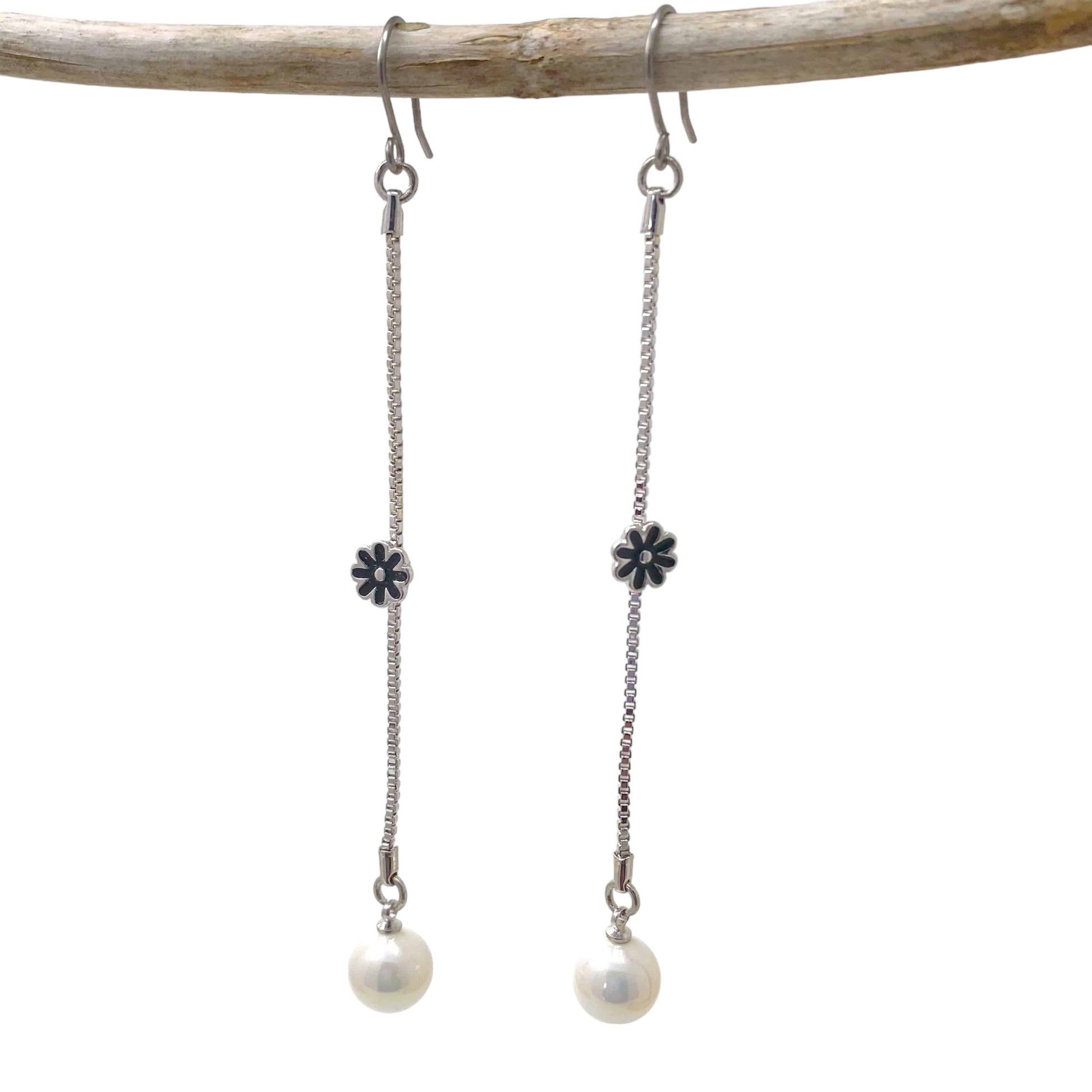 a pair of titanium earrings against a white background