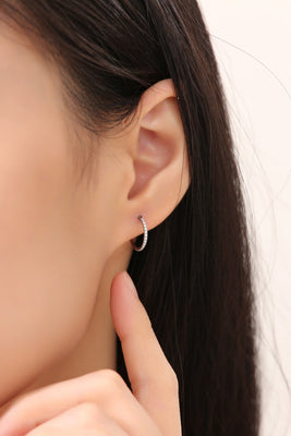 Small Hoop earrings made from titanium on a white woman again. Mini gem studded earring pair, lightweight and durable.