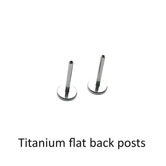 Two titanium flat back posts on a white background with text indicating the material.