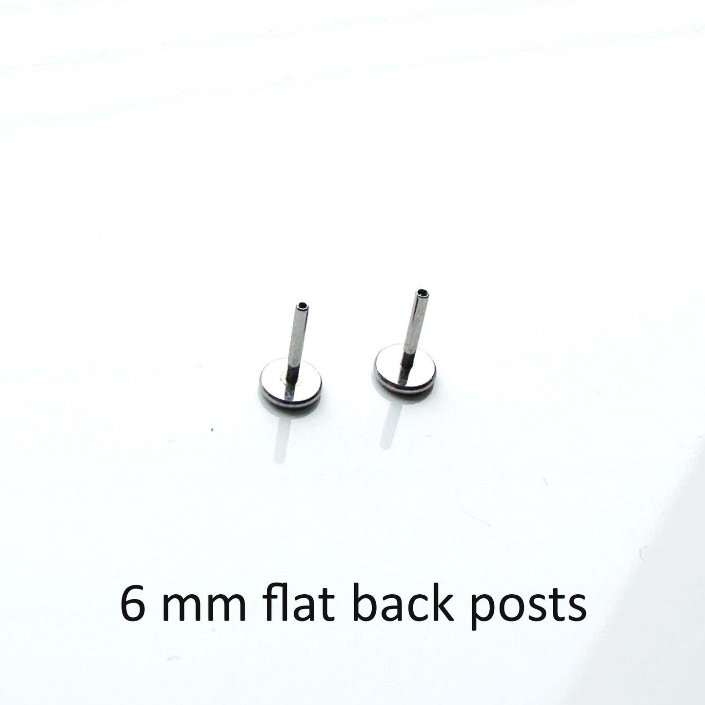 Pair of 6 mm  20 gauge flat back posts on a white background