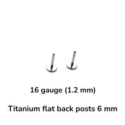 Two small titanium flat back posts, 16 gauge (1.2 mm) and 6 mm, shown on a plain white background with descriptive text below.