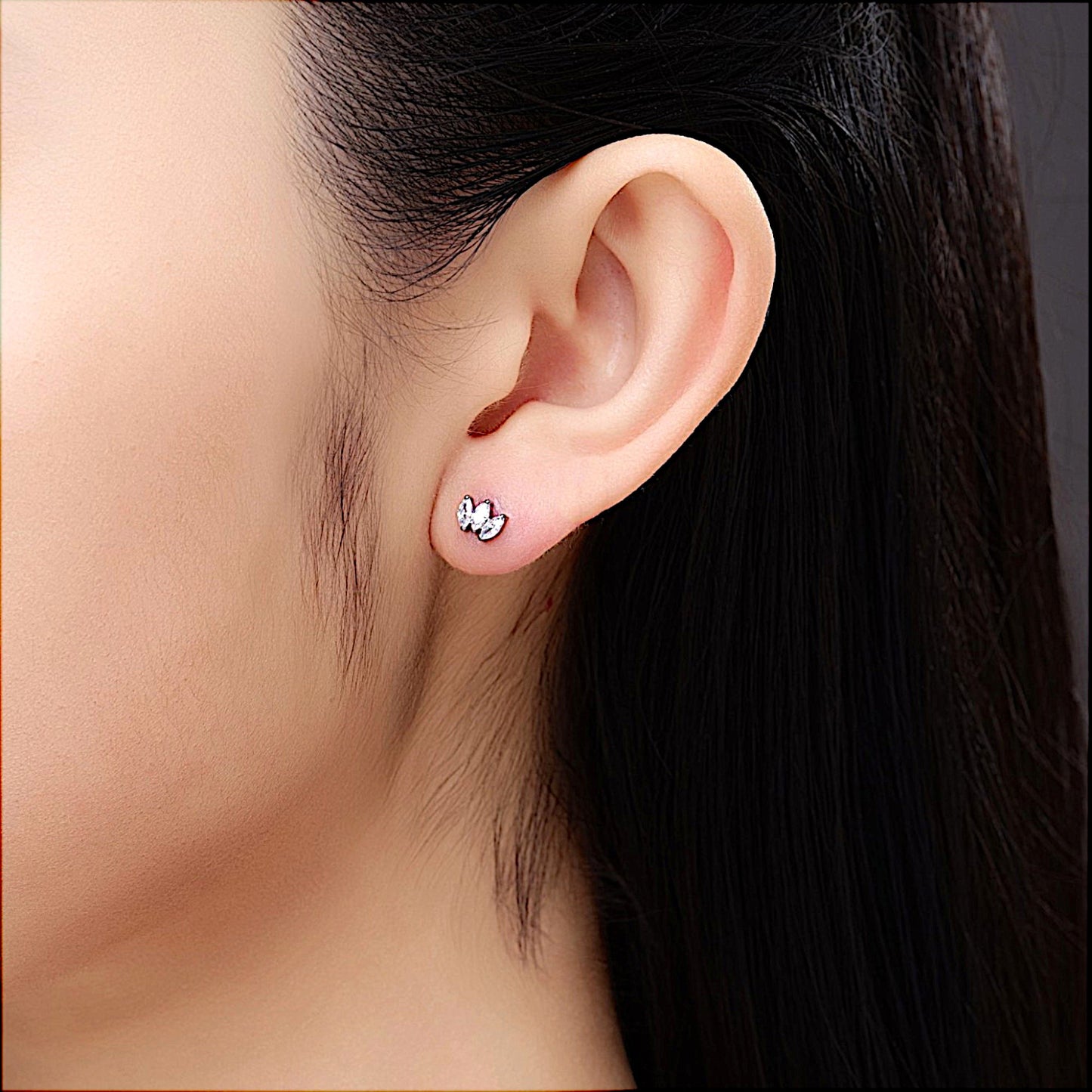 Titanium triple diamond gem flat back stud on a white woman