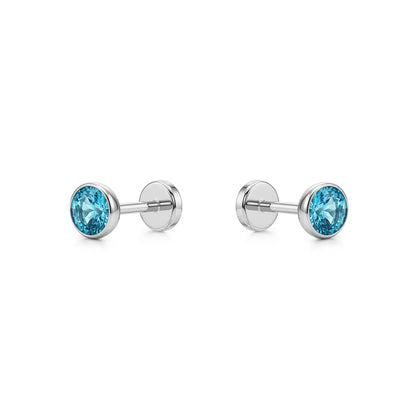 Aqua titanium 4 mm zirconium flatback  studs on a white background