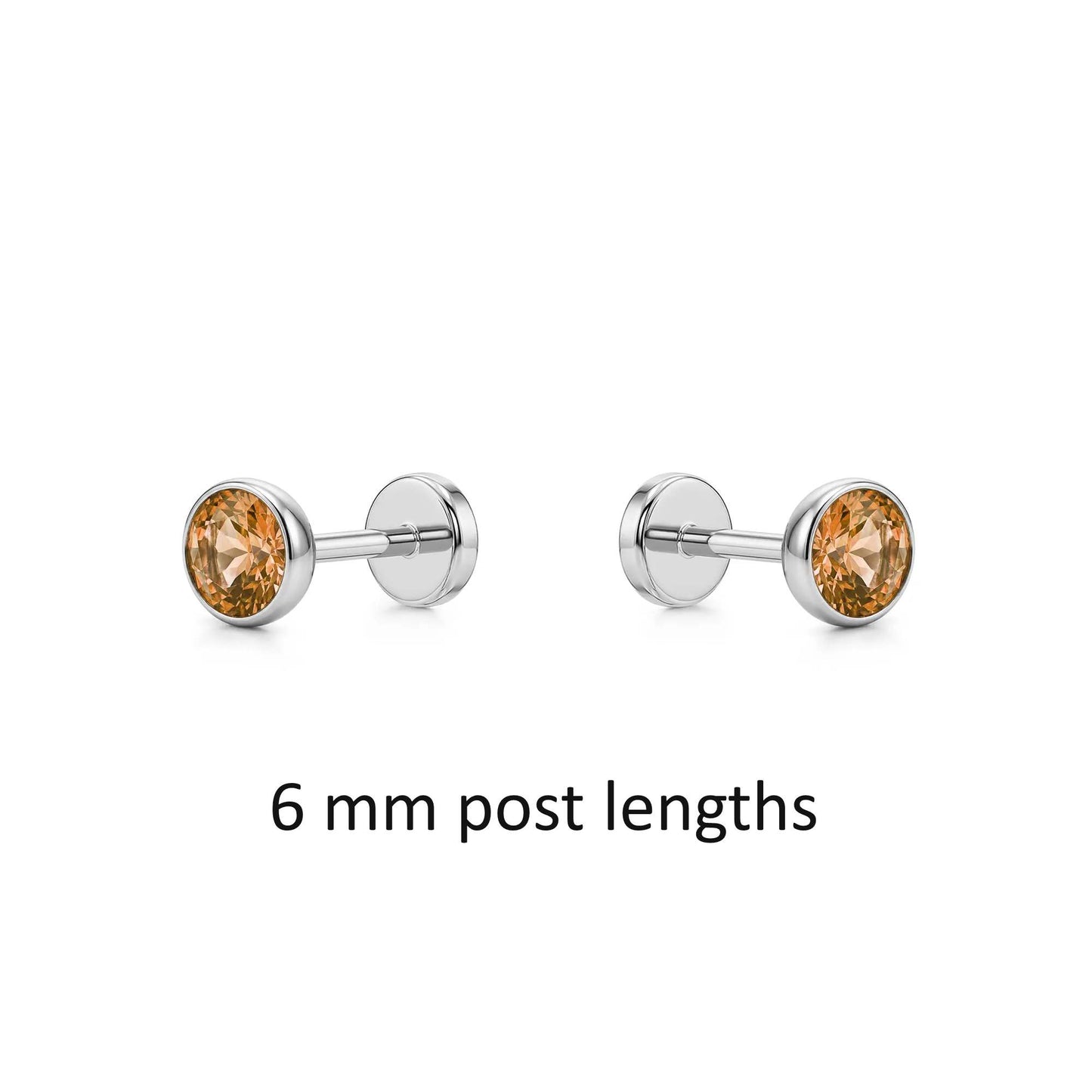 Pair of titanium earrings with Champagne gemstones 6 mm post lengths on a white background