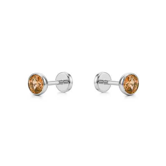 Pair of titanium stud earrings with Champagne gemstones on a white background