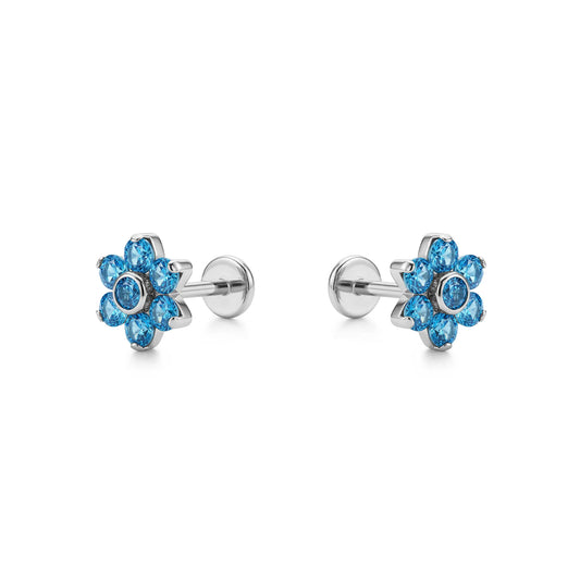 Pair of titanium flat back push in blue flower-shaped earrings on a white background