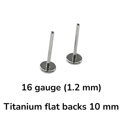 Two titanium flat-back labret studs in 16 gauge (1.2 mm) size with 10 mm flat backs, shown on a white background with black text overlay detailing the specifications.