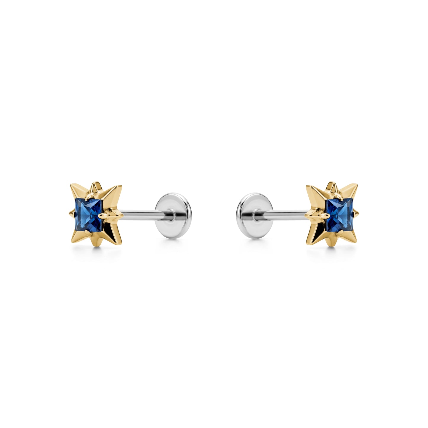 Star-shaped titanium flat back earrings with blue gemstones and gold accents on a white background