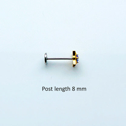 Single titanium gold gem earring on a post 8 mm with a light white background