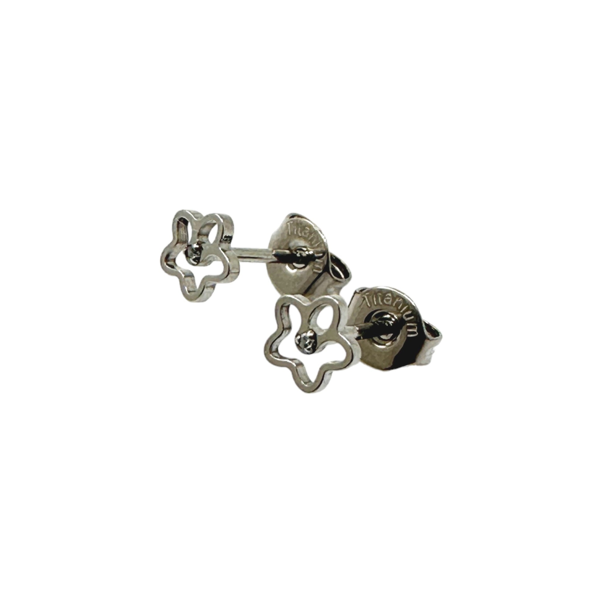 Flower stud earrings. Titanium Studs and backs adjustable fit. These minimal studs shown on a white background