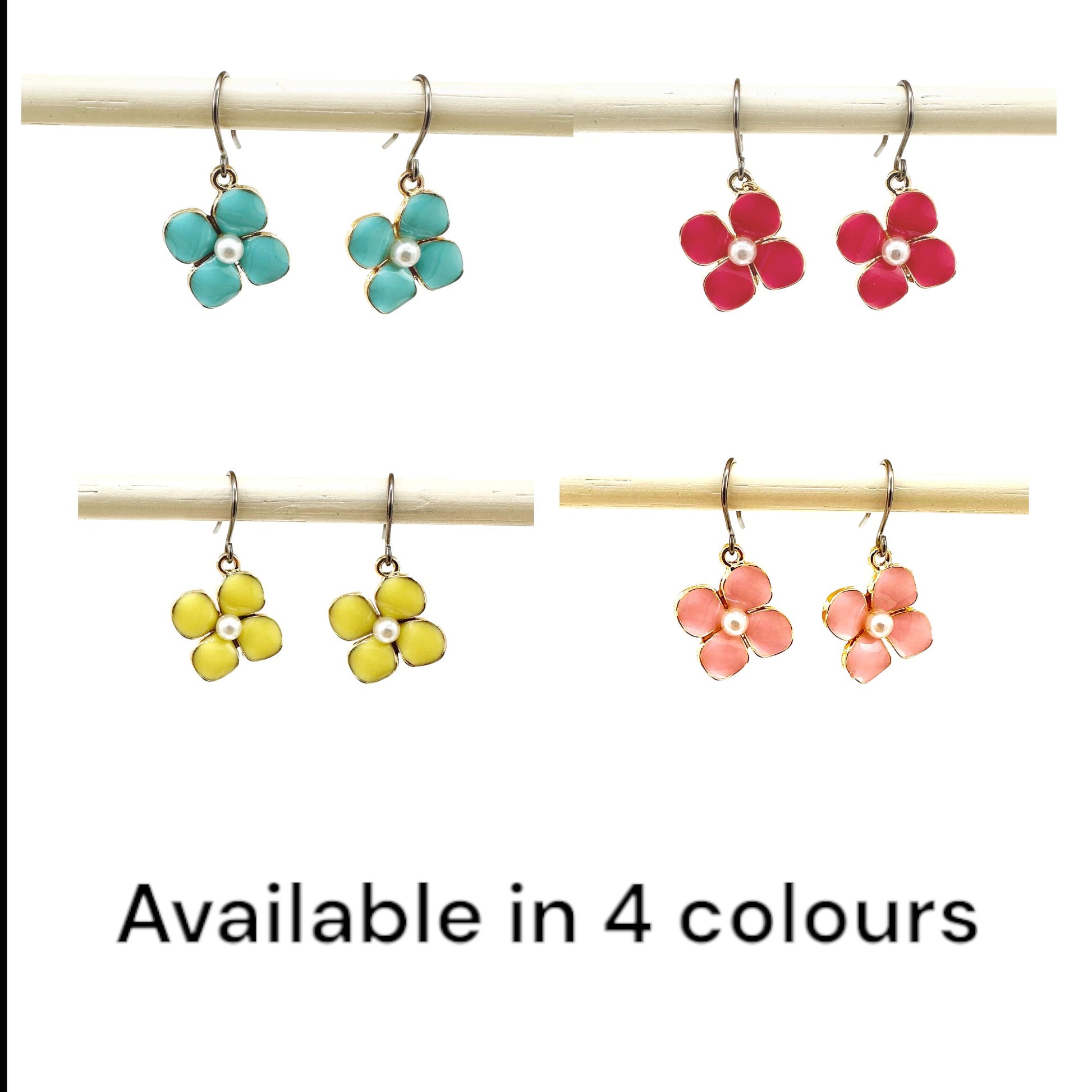 Forget-Me-Not Charm earrings available in 4 colours with a pearl in the center and a titanium hook on a white background