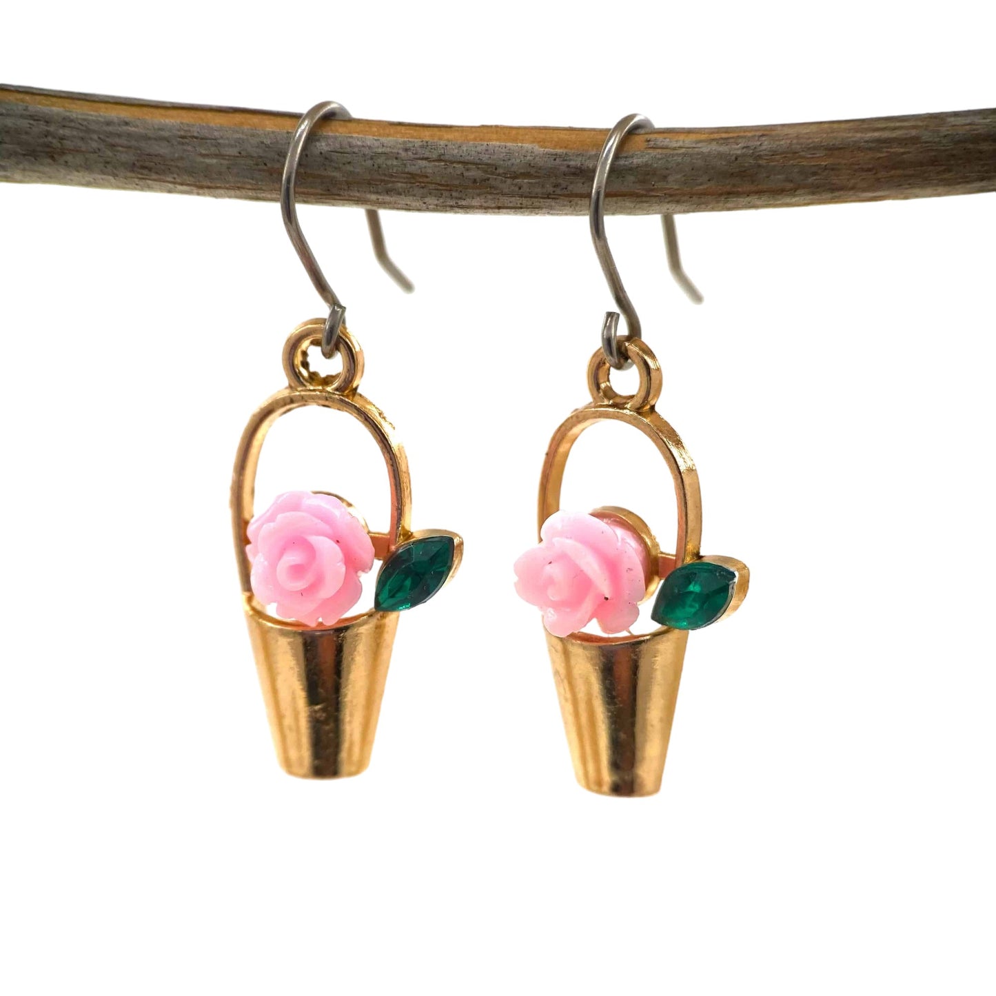 Gardener’s Charm earrings in gold with pink flower and a titanium hook on a white background